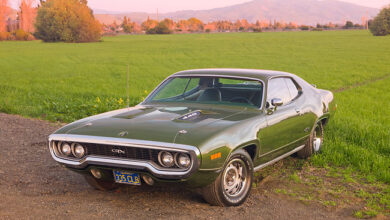 1971 Plymouth GTX Green 3/4 Front View On Dirt By Grass